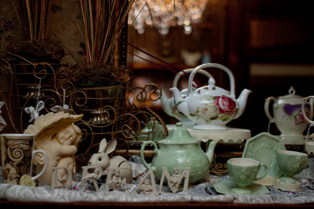 Tea pots and cups on buffet